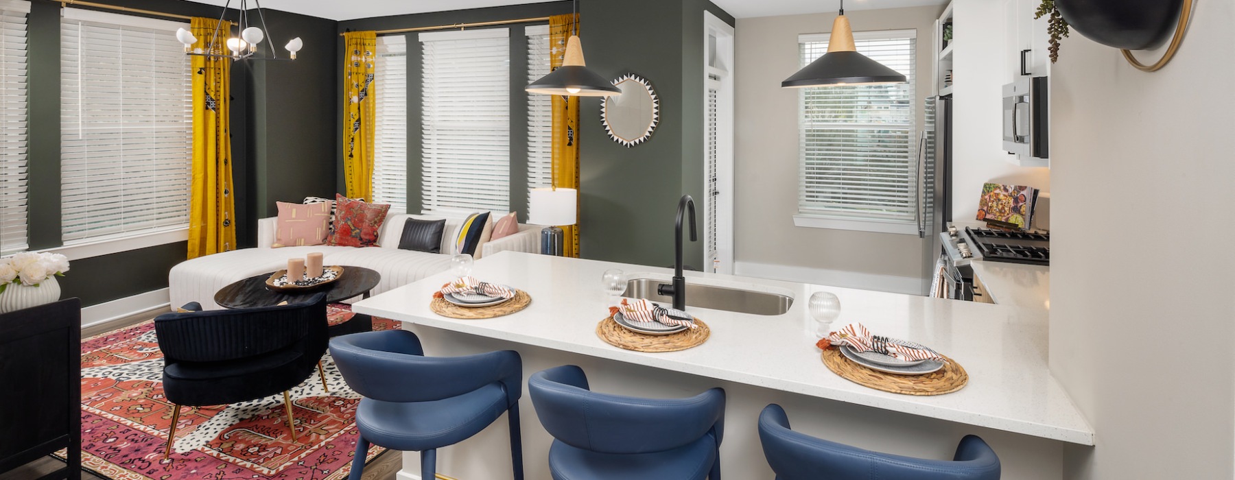 a kitchen with a bar and seating
