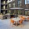 outdoor lounge area with modern seating and a firepit