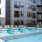 pool with reclining seats and modern stonework